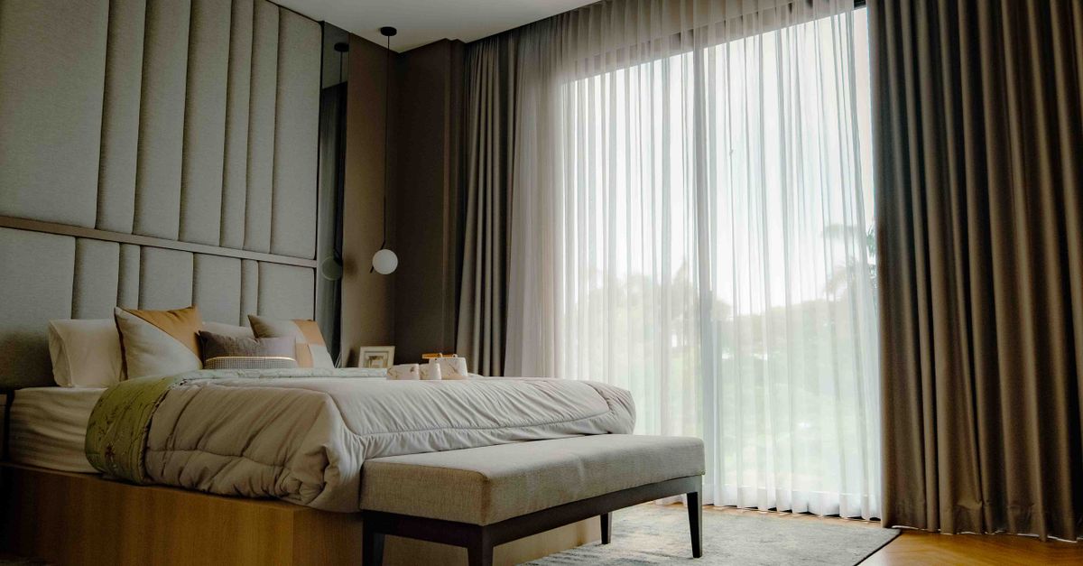 Contemporary bedroom in Jakarta with elegant design and abundant natural light.