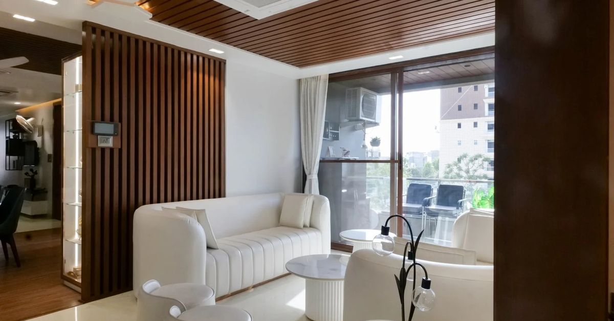 Contemporary Indian living room featuring elegant sheesham wood furniture and decor.