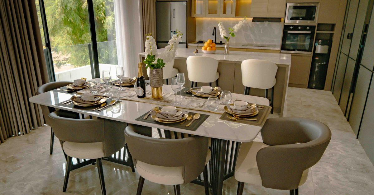 Stylish dining and kitchen area with modern interior design in Jakarta.